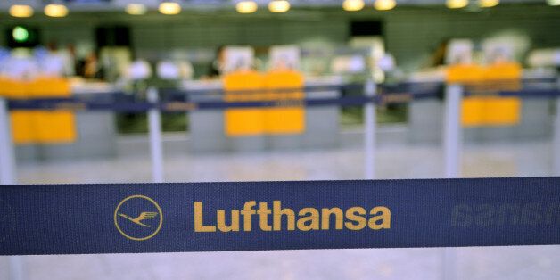 FRANKFURT AM MAIN, GERMANY - OCTOBER 21: The logo of the airline Lufthansa pictured in front of the empty counter at the Frankfurt Airport on October 21, 2014 in Frankfurt am Main, Germany. Vereinigung Cockpit, the labor union that represents the pilots, launched the two-day strike yesterday that has been expanded from short and medium-distance flights on the first day to long haul flights today, affecting over 100,000 passengers. This is the seventh strike by Lufthansa and Germanwings (a Luftha