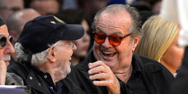Actors Bruce Dern, left, and Jack Nicholson watch the Los Angeles Lakers play the Indiana Pacers during the second half of an NBA basketball game, Tuesday, Jan. 28, 2014, in Los Angeles. (AP Photo/Mark J. Terrill)
