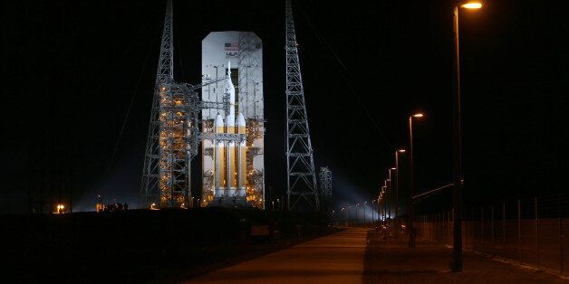 CAPE CANAVERAL, FL - DECEMBER 04: A United Launch Alliance Delta 4 rocket carrying NASA's first Orion deep space exploration craft sits on its launch pad as it is prepared for a 7:05 AM launch on December 4, 2014 in Cape Canaveral, Florida. The heavy-lift rocket will boost the unmanned Orion capsule to an altitude of 3,600 miles, and returning for a splashdown west of Baja California after a four and half hour flight. (Photo by Joe Raedle/Getty Images)