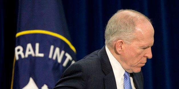 Central Intelligence Director (CIA) Director John Brennan walks away following the conclusion of his news conference at CIA Headquarters in Langley, Va., Thursday, Dec. 11, 2014. Brennan is pushing back hard against the wave of criticism following a Senate Intelligence Committee report detailing harsh interrogation tactics employed by intelligence community people against terrorism war-era detainees. Brennan and several past CIA leaders fear the historical record may define them as torturers instead of patriots. The CIA is now in the uncomfortable position of defending itself publicly, given its basic mission to protect the country secretly. (AP Photo/Pablo Martinez Monsivais)