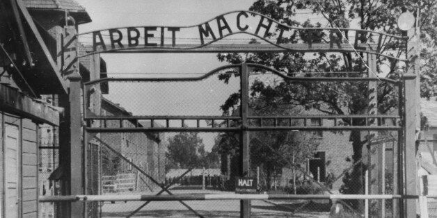 FILE - This undated file image shows the main gate of the Nazi concentration camp Auschwitz I, near Oswiecim , Poland, which was liberated by the Russians in January 1945. Writing at the gate reads: