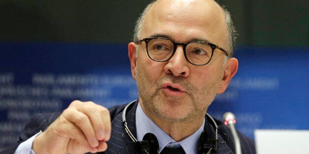 European Commissioner for Economic and Financial Affairs Pierre Moscovici addresses the Committee on Economic and Monetary Affairs on the draft budgetary plans of euro area member states, at the European Parliament building, in Brussels on Tuesday, Dec. 2, 2014. (AP Photo/Yves Logghe)