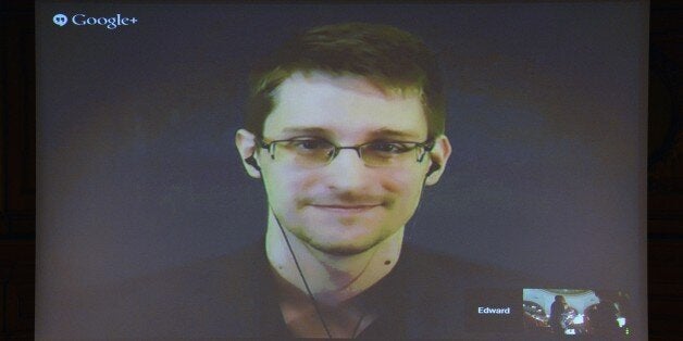 US National Security Agency (NSA) whistleblower Edward Snowden speaks via live video call during the Right Livelihood prize ceremony at the parliament in Stockholm, on December 1, 2014. Snowden was awarded the Right Livelihood Honorary Award 'for his courage and skill in revealing the unprecedented extent of state surveillance violating basic democratic processes and constitutional rights. The Right Livelihood Award was founded by journalist and professional philatelist Jakob von Uexkull in 1980. AFP PHOTO/JONATHAN NACKSTRAND (Photo credit should read JONATHAN NACKSTRAND/AFP/Getty Images)