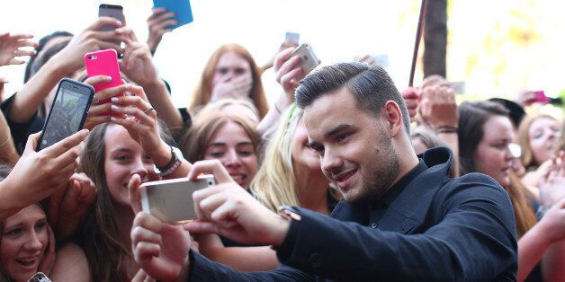 SYDNEY, AUSTRALIA - NOVEMBER 26: Liam Payne from One Direction takes a selfie with fans at the 28th Annual ARIA Awards 2014 at the Star on November 26, 2014 in Sydney, Australia. (Photo by Cameron Spencer/Getty Images)