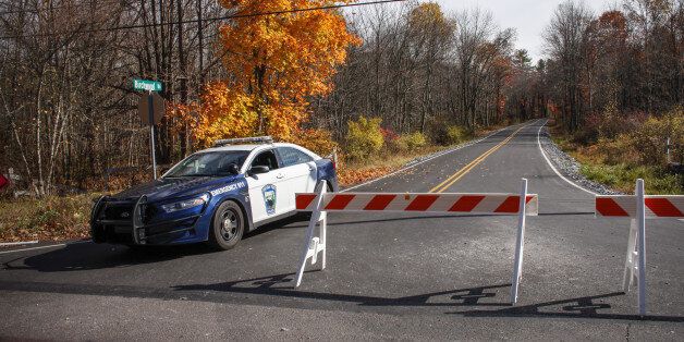 CRESCO, PA - OCTOBER 31: A Pocono Police car sits on the route to the hangar where Eric Matthew was captured on Thursday night, on October 31, 2014 in Cresco, Pennsylvania. Frein, a suspected cop killer, was taken into custody from a Pennsylvania airport hangar after a seven-week manhunt. (Photo by Kena Betancur/Getty Images)