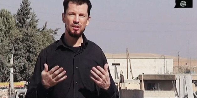 In this still image taken from an undated video published on the Internet by the Islamic State group militants, captive British journalist John Cantlie speaks into a camera in what he identifies as the embattled Syrian town of Kobani. In the video, Cantlie says Islamic State fighters have pushed deeper into the town despite airstrikes by a U.S.-led coalition. It's the latest propaganda video in which Cantlie is exploited by the extremists to take on the role of a war correspondent. AP cannot verify the location independently. (AP Photo)