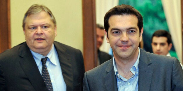 Greece's radical leftist party Syriza chief Alexis Tsipras (R) leaves the office of Socialists leader Evangelos Venizelos (L) after their meeting at the Greek parliament in Athens on may 11, 2012. Venizelos admitted that he had failed in a last-ditch bid to form a government after Syriza key leftist party ruled out joining a pro-austerity coalition. AFP PHOTO/LOUISA GOULIAMAKI (Photo credit should read LOUISA GOULIAMAKI/AFP/GettyImages)