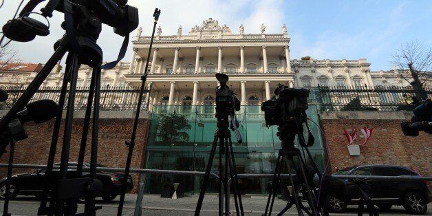 Cameras stand in front of Palais Coburg where closed-door nuclear talks of six world powers with Iran take place in Vienna, Austria, Sunday, Nov. 23, 2014. (AP Photo/Ronald Zak)