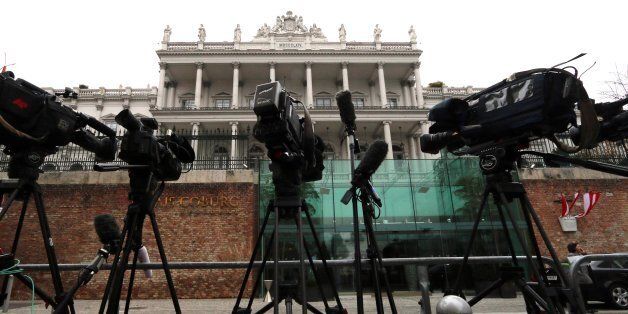 Cameras stand in front of Palais Coburg where closed-door nuclear talks with Iran take place in Vienna, Austria, Saturday, Nov. 22, 2014. (AP Photo/Ronald Zak)