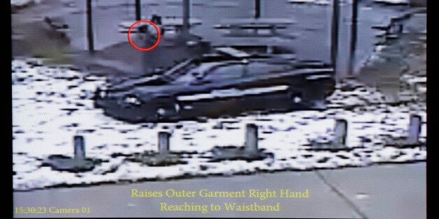 This still image taken from a surveillance video played at a news conference held by Cleveland Police, Wednesday, Nov. 26, 2014, shows Cleveland police officers arriving at Cudell Park on a report of a man with a gun. Twelve-year-old Tamir Rice was fatally shot by a Cleveland police officer Saturday, Nov. 22, 2014, after he reportedly pulled a replica gun at the city park. (AP Photo/Mark Duncan)