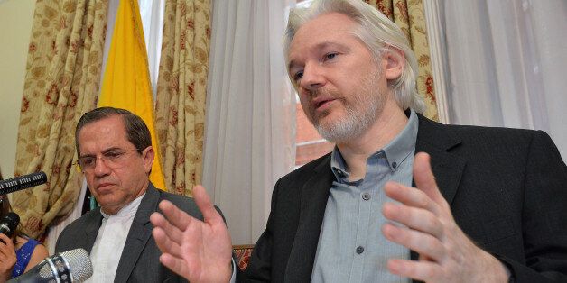 Ecuador's Foreign Minister Ricardo Patino, left, and WikiLeaks founder Julian Assange speak during a press conference inside the Ecuadorian Embassy in London, where he confirmed he