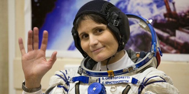 Italian astronaut Samantha Cristoforetti, crew member of the mission to the International Space Station, ISS, waves prior to the launch of Soyuz-FG rocket at the Russian leased Baikonur cosmodrome, Kazakhstan, Sunday, Nov. 23, 2014. (AP Photo/Dmitry Lovetsky)