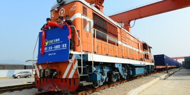 JINHUA, CHINA - NOVEMBER 18: (CHINA OUT) The inauguration ceremony of China-Europe Block Train (Yiwu-Madrid) at Yiwu Railway Freight Station on November 18, 2014 in Jinhua, Zhejiang province of China. The first China-Europe Block Train carrying 82 containers of exported goods set out for Madrid on Tuesday which meant that the Yiwu-Madrid railway line opened formally. As the longest railway line of China-European lines, the train passes through Kazakhstan, Russia, the Republic of Belarus, Poland