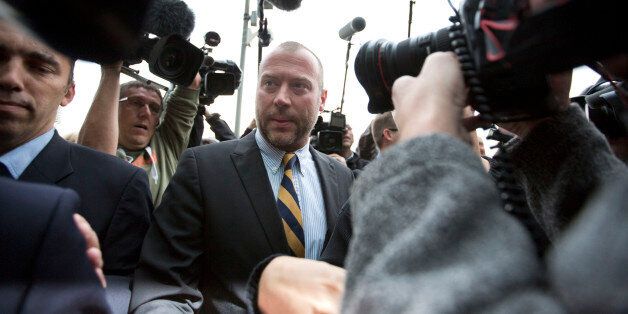 Dimitri Bontinck, center, father of co- defendant and key witness Jejoen Bontinck, center, speaks with the press as he arrives to the main courthouse in Antwerp, Belgium on Monday, Sept. 29, 2014. Dozens of Belgians on Monday are going on trial accused of leading or being members of a terrorist organization that allegedly recruited fighters for jihadi groups in Syria. The case, one of the biggest-ever terror trials in Belgium, centers on the radical Muslim group Sharia4Belgium and its members. (AP Photo/Virginia Mayo)