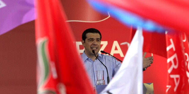 ATHENS, GREECE - MAY 22: Before the European Parliament election, Syriza party leader Alexis Tsipras speaks to crowd during his party's main election rally at Omonia square in Athens, Greece on May 22, 2014. (Photo by Ayhan Mehmet/Anadolu Agency/Getty Images)