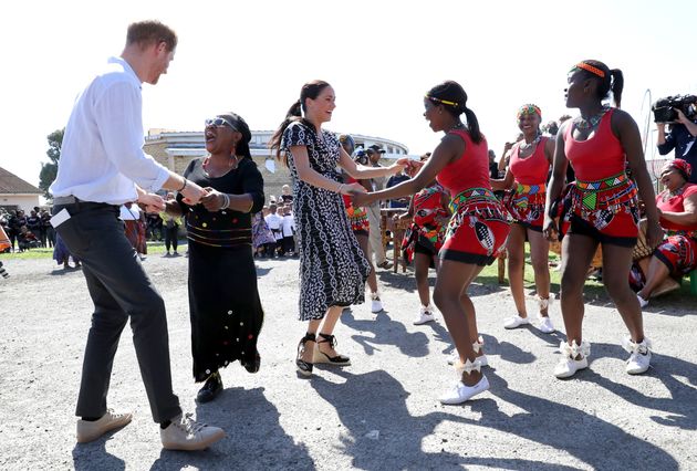 The Sussexes dance as they visit a Justice Desk initiative in Nyanga township. 