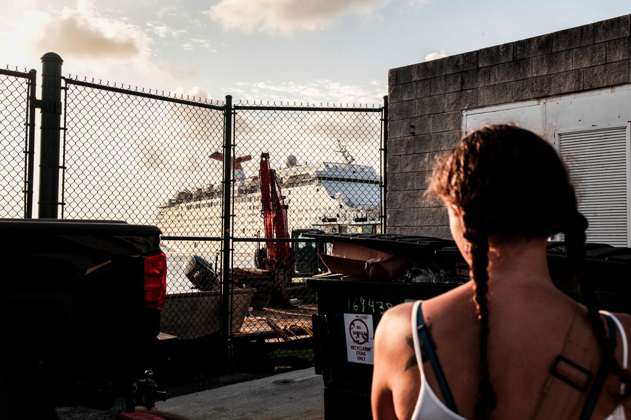 Sarah Renee Oźlański stands to watch the Grand Celebration start to dock. Oźlański waits for her Bahamian friend and infant to come on land and host them temporarily in West Palm Beach Sept. 18, 2019.