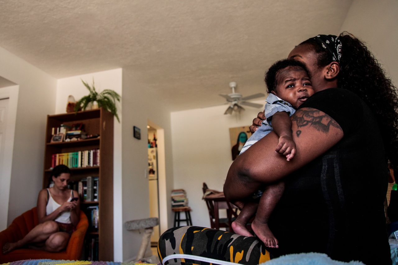 Natandra Lewis her newborn Chandler escaped Hurricane Dorians storm surge and are lucky to have clean water and restful nights in West Palm Beach after arriving from Freeport, Grand Bahama Wednesday morning, Sept. 18, 2019.