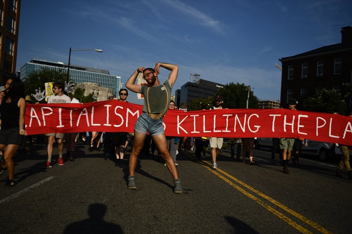 Environmental activists gather in Washington on Monday during global climate action week.