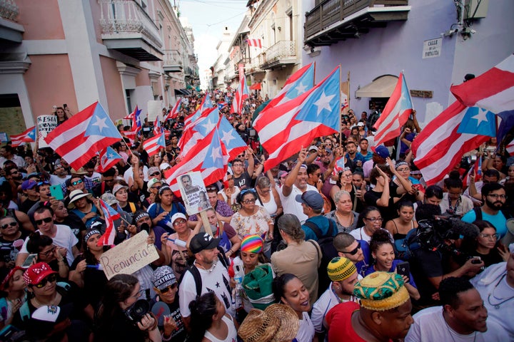 Demonstrators protest in front of the mansion of Puerto Rico's Governor, Ricardo Rossello, known as La Fortaleza, in San Juan