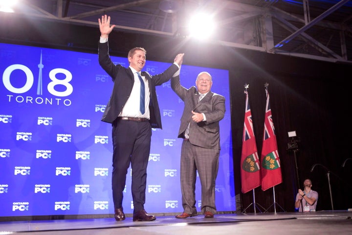 Federal Conservative Leader Andrew Scheer, left, is joined on stage by Ontario Premier Doug Ford after addressing the Ontario PC Convention in Toronto on Nov. 17, 2018. 