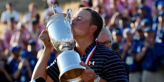 UNIVERSITY PLACE, WA - JUNE 21: Jordan Spieth of the United States kisses the trophy after winning the 115th U.S. Open Championship at Chambers Bay on June 21, 2015 in University Place, Washington. (Photo by Ross Kinnaird/Getty Images)