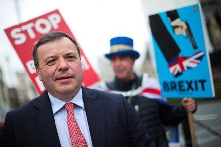 Arron Banks and anti-Brexit protester Steve Bray are seen outside the Houses of Parliament in London