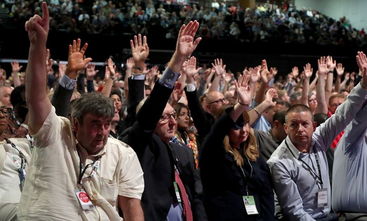 Len McCluskey, general secretary of Unite the union (centre) and delegates voting on Labour's Brexit policy during the Labour party conference in Brighton. 