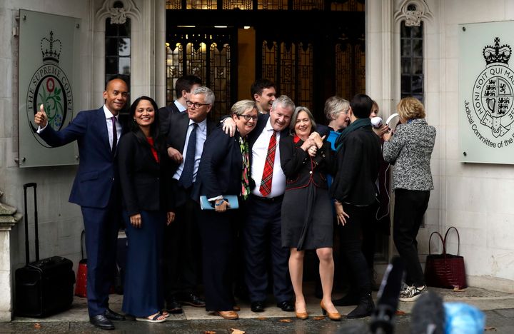 Anti-Brexit campaigners celebrate the U.K. Supreme Court's decision on the legality of British Prime Minister Boris Johnson's five-week suspension of British parliament. 