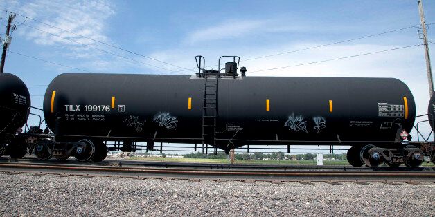 In this Aug. 8, 2012 photo, a DOT-111 rail tanker passes through Council Bluffs, Iowa. DOT-111 rail cars being used to ship crude oil from North Dakota's Bakken region are an