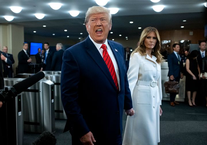 U.S. President Donald Trump addresses reporters as he arrives with first lady Melania Trump for the 74th session of the United Nations General Assembly, at U.N. headquarters, Tuesday, Sept. 24, 2019. (AP Photo/Craig Ruttle)
