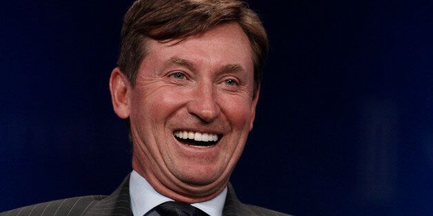 Former hockey player Wayne Gretzky laughs during the annual Milken Institute Global Conference in Beverly Hills, California, U.S., on Monday, May 1, 2013. The conference brings together hundreds of chief executive officers, senior government officials and leading figures in the global capital markets for discussions on social, political and economic challenges. Photographer: Jonathan Alcorn/Bloomberg via Getty Images
