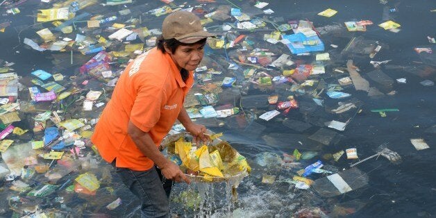 Plastic bags and other rubbish are collected from the waters of Manila Bay on July 3, 2014 during a campaign by environmental activists and volunteers calling for a ban of the use of plastic bags. Volunteers from various environmental advocates collected and separated assorted plastic rubbish polluting Manila Bay and called for national legislation against plastic bags in observance of the 5th International Plastic Bag-Free Day on July 3. AFP PHOTO / Jay DIRECTO (Photo credit should read JAY DIRECTO/AFP/Getty Images)