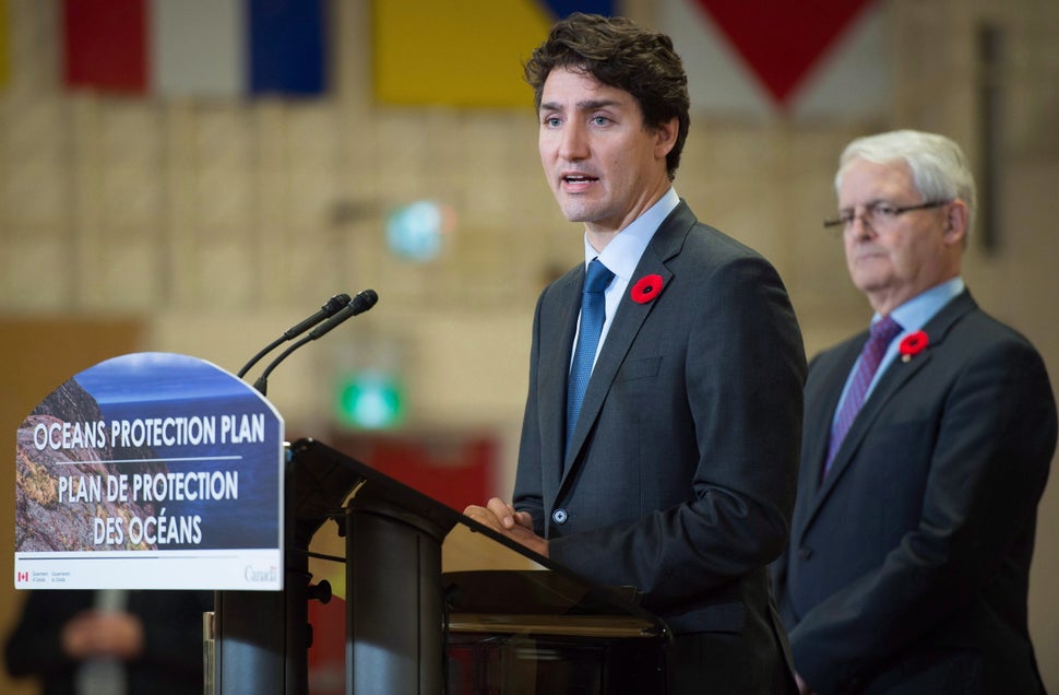 Prime Minister Justin Trudeau announces a $1.5-billion national Oceans Protection Plan as Transport Minister Marc Garneau listens, at HMCS Discovery in Vancouver, B.C., on Nov, 7, 2016.