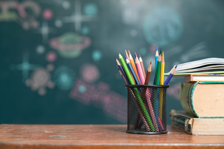 School books on desk, education concept(小学校のイメージ写真)