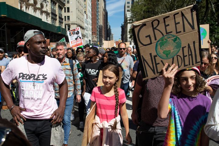 Swedish environmental activist Greta Thunberg, center, takes part during the Climate Strike, Friday, Sept. 20, 2019 in New York. 