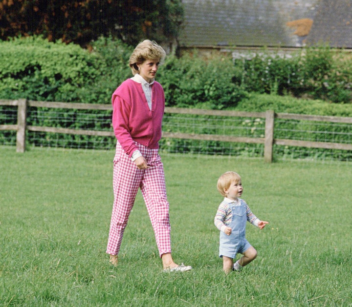 Prince Harry and Princess Diana walking in the grounds at Highgrove. 