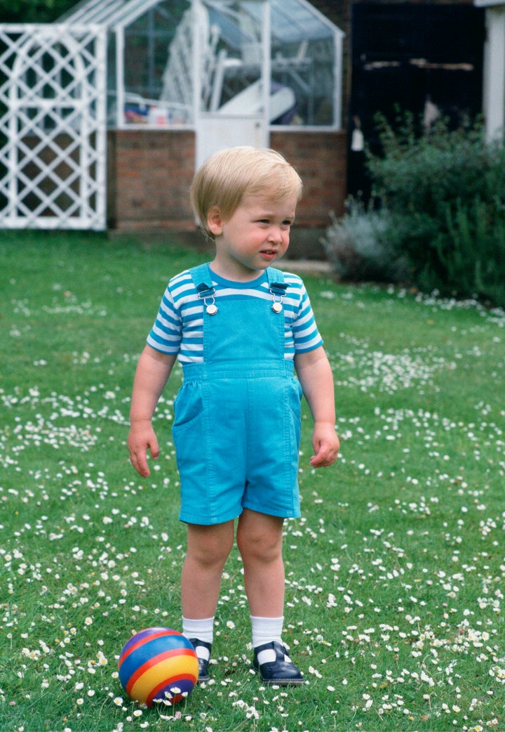 Prince William is a sweetheart in overalls just before his second birthday.