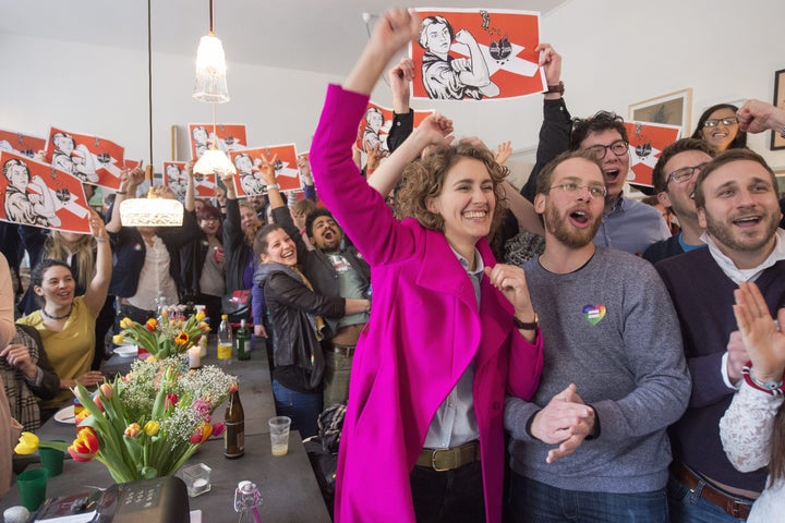 Flavia Kleiner cheers at a rally in Bern, Switzerland, after the rejection of an anti-immigrant initiative by Swiss voters on Feb. 28, 2016.