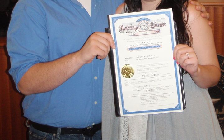 "The judge insisted on taking a picture of us after the ceremony, so we stood awkwardly with our marriage license in tow."