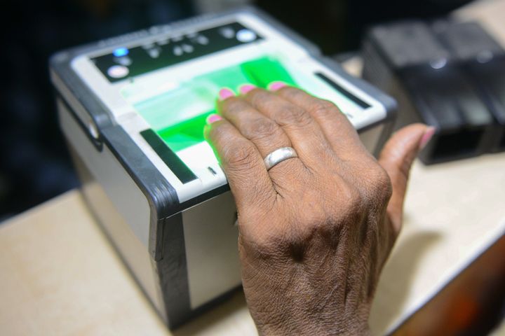 This photo taken on July 17, 2018 shows an Indian woman getting her fingerprints read during the registration process for Aadhaar cards (or unique identifier [UID] cards) in Amritsar.