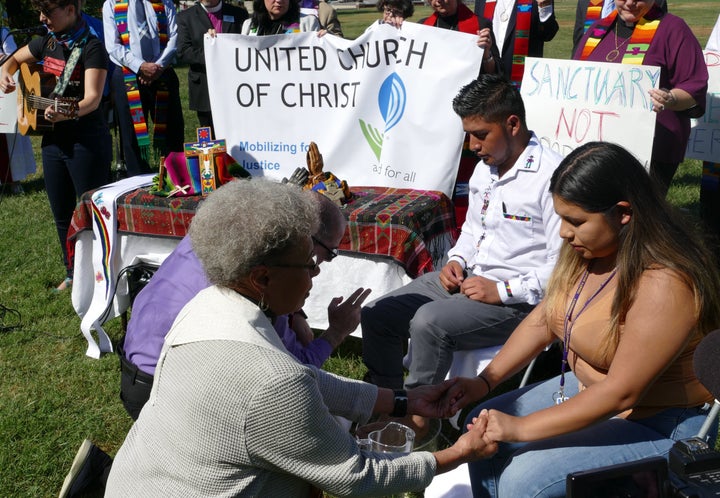 Two United Church of Christ pastors and two immigrant activists participated in a foot-washing ceremony on the Capitol lawn Wednesday.