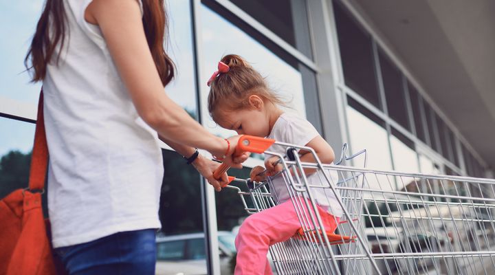 Mother telling her daughter no to buying cakes and be calm