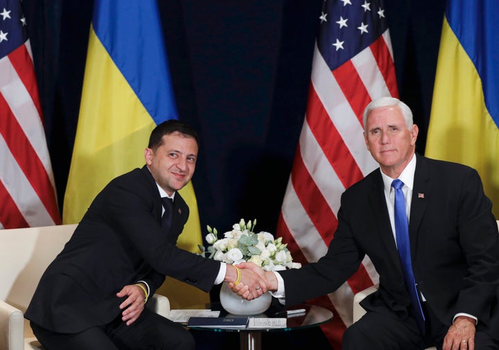 Ukrainian President Volodymyr Zelenskiy, left, shakes hands with U.S. Vice President Mike Pence in Warsaw, Poland, Sept. 1, 2
