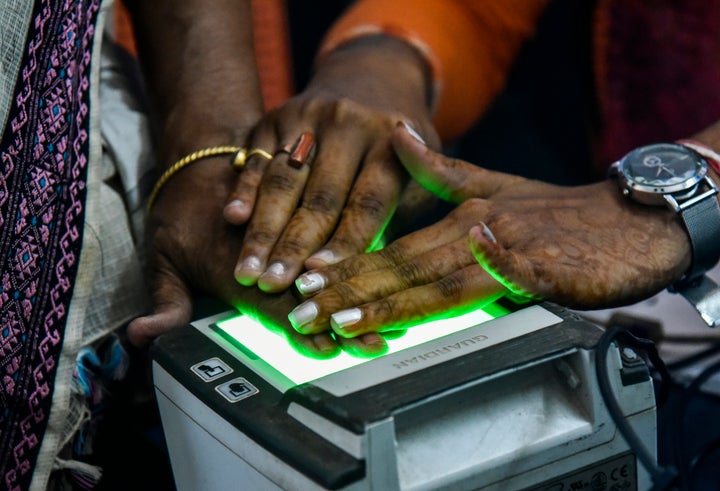 Women scanning fingerprints as an Adhar registration process in an Adhar registration office in Guwahati, Assam, India on Monday, October 8, 2018.