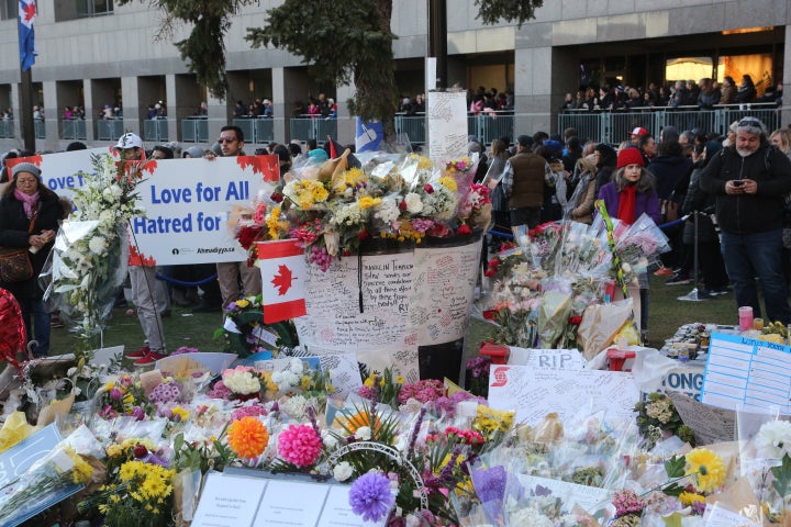 Flowers and messages of condolence at a memorial during a vigil at Nathan Phillips Square in memory of the 10 people killed and 15 people injured in a deadly van attack in Toronto