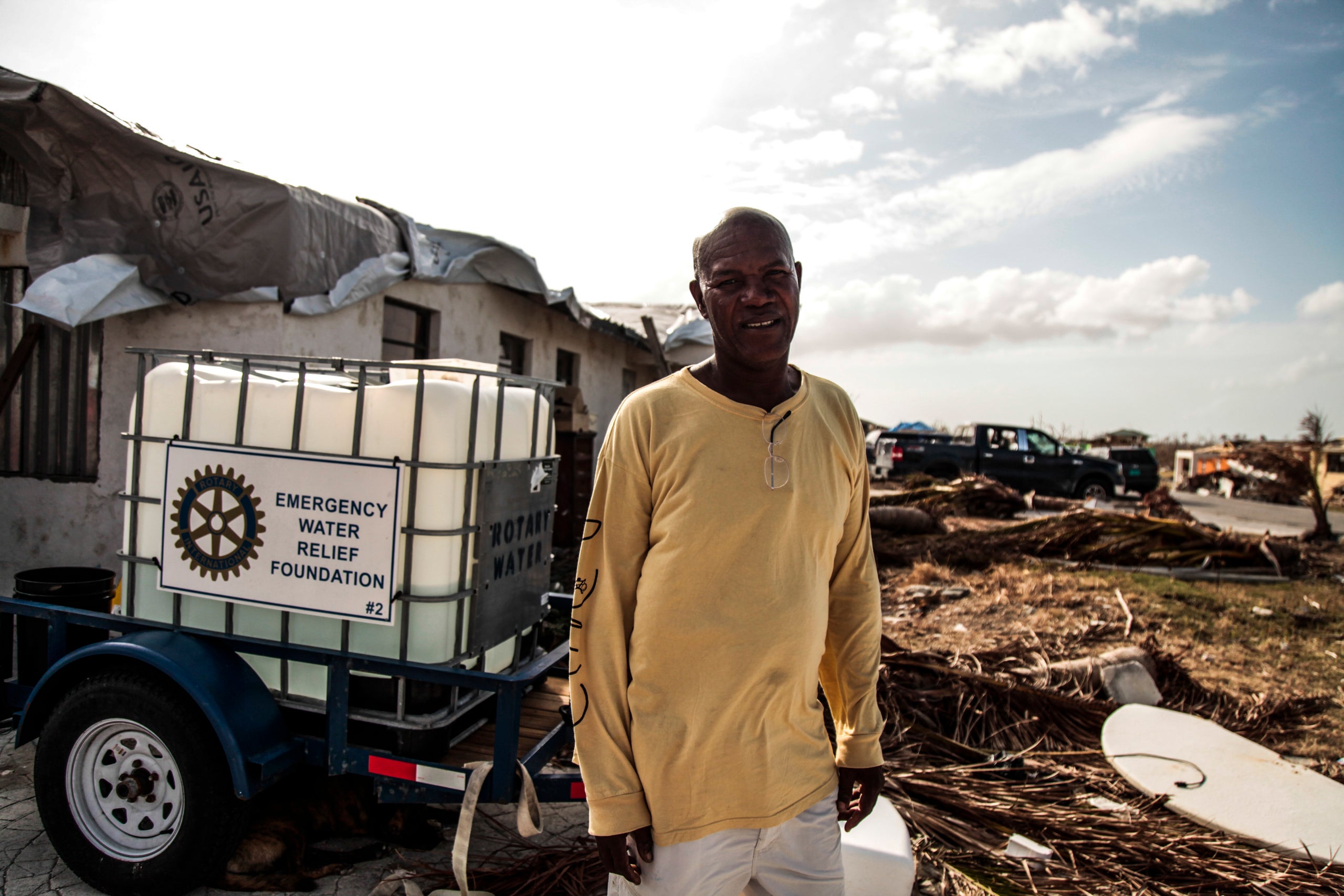 Phillip Thomas Sr. stands in front of his home in McLean's Town, Grand Bahama, where he stayed during Hurricane Dorian. His s