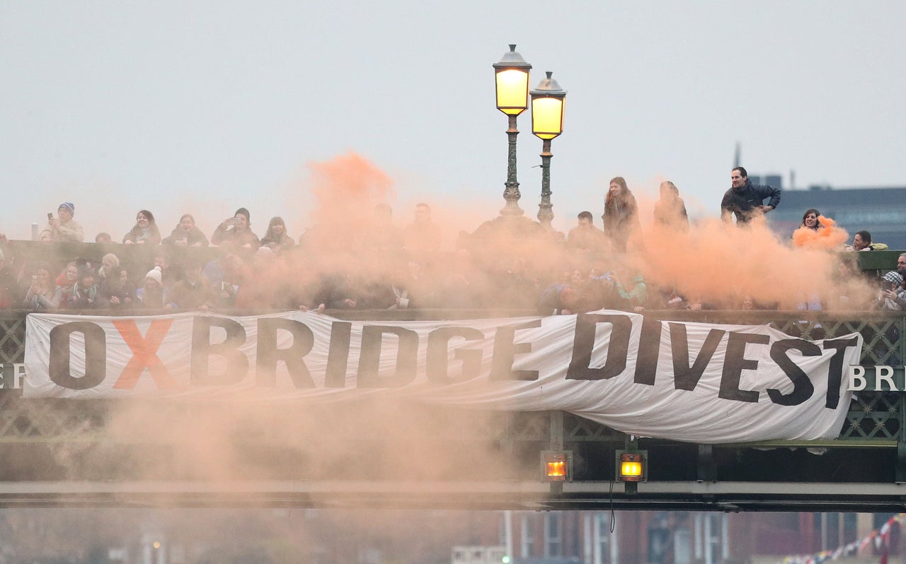 Oxford and Cambridge student environmental activists protest in London in 2018 demanding that "both universities commit to full divestment from fossil fuels."