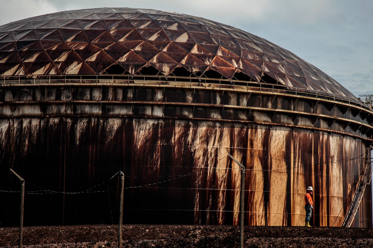 Oil covers a tank at Equinor's oil storage and shipping terminal in South Riding Point, Grand Bahama on Sept. 24, 2019.