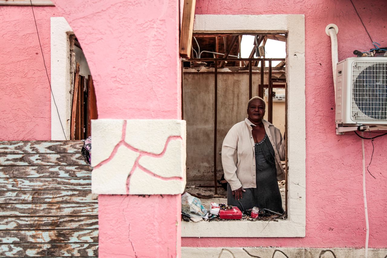 Rachel Rolle stands inside what remains of her home in McLean's Town, Grand Bahama, on Sept. 22, 2019.